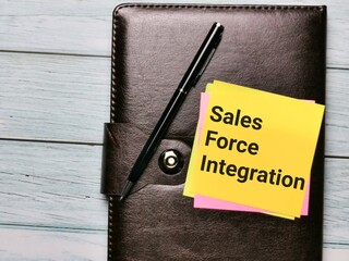 Phrase sales force integration written on sticky note with a pen.