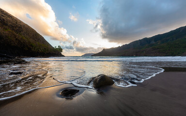 Landscape of Puamau Bay in Hiva Oa, Marquesas Islands, French Polynesia. Sea side with rocks and mountains.