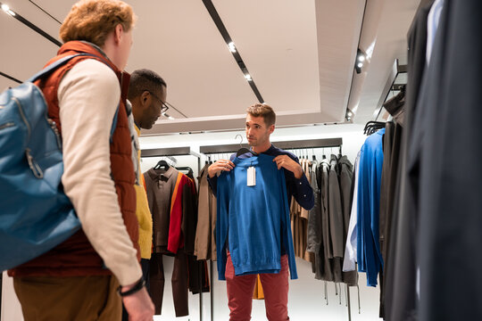 Men In Shop Of Clothes