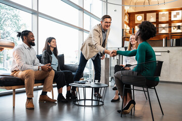 Businessman Shaking Hands With His Associates In A Meeting