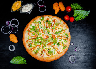 Pizza with nuggets and cheese