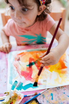 Little Girl having fun painting and drawing