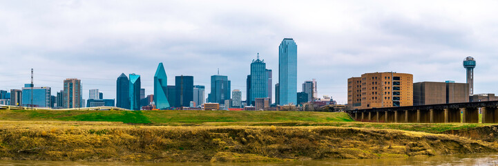Fototapeta na wymiar Dallas City downtown skyline, cityscape after rain in winter, a view from the Trinity River Skyline Trail near Reunion Tower in Texas, USA