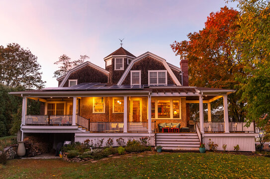 Exterior of Craftsman home  porch in Autumn at sunset backyard 