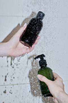 Transparent Plastic Bottles Of Shower Gel in Bathroom