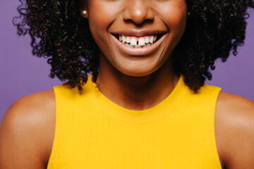 Cheerful cropped woman with curly hair