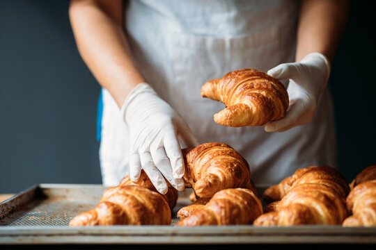 Woman Holding Croissants 