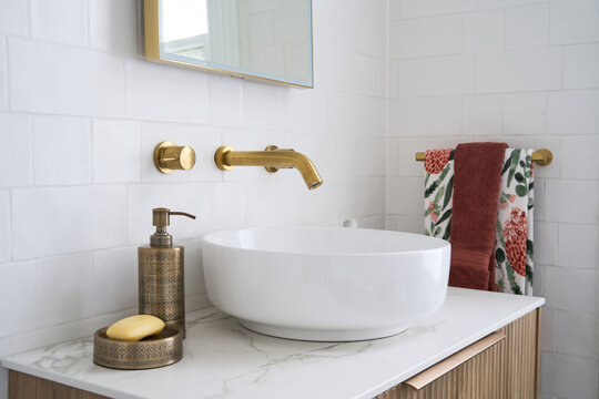 Modern bathroom with brass tap ware
