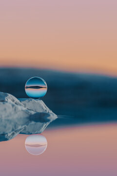 rendered landscape with glass sphere