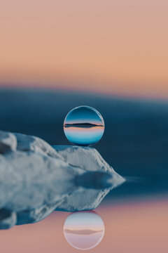 rendered landscape with glass sphere