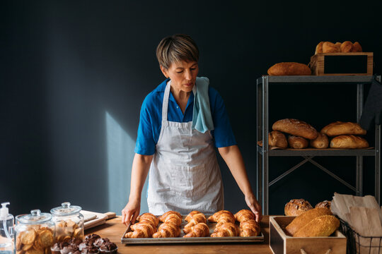 Woman Holding Croissants 