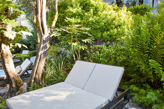 Double chaise lounger on patio