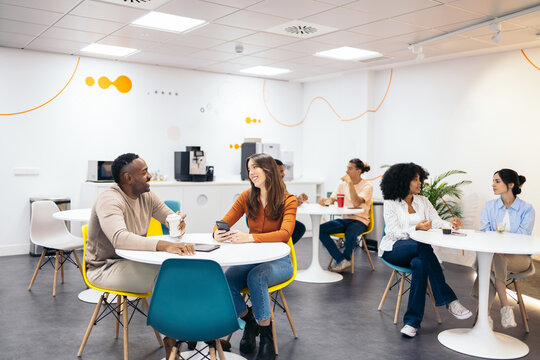 Business colleagues having a break in a coworking - Powered by Adobe