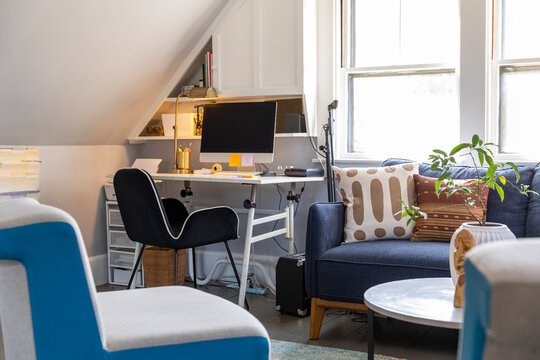 Home office with desk and chair and computer 