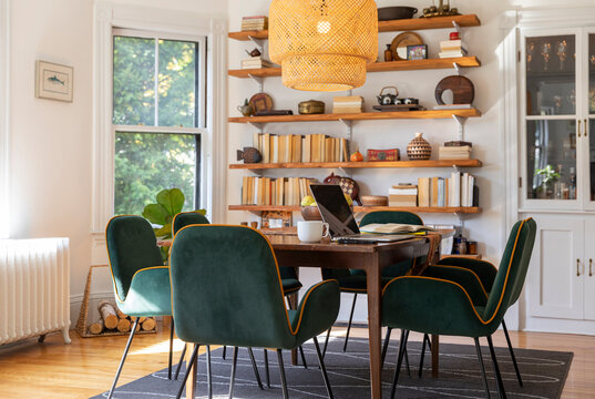 Dining room  in contemporary home with laptop computer on table 