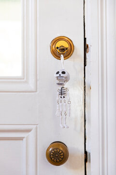 Skeleton key in lock of door with doorknob