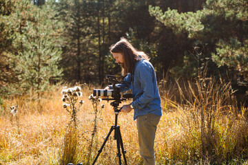 Man using camera on tripod