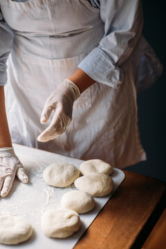Woman Making Dough for Cookies in Bakery 