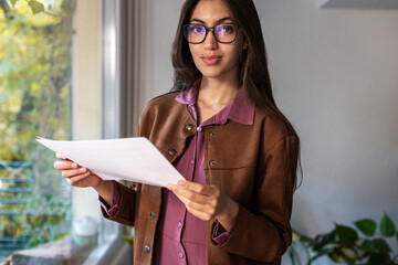 Woman freelancer analyzing charts 