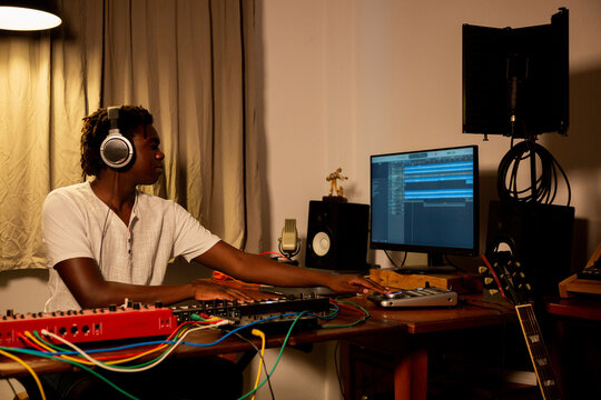 Man enjoys playing music in his studio