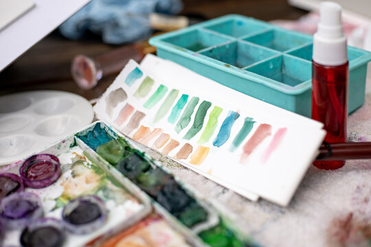 Close up of craftswoman watercolor palette