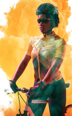 Confident african american cyclist wearing helmet and glasses standing with bike on smoky background