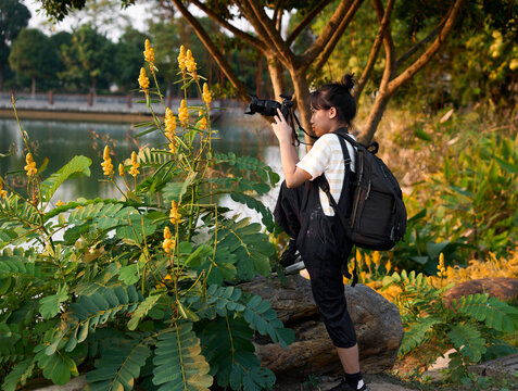 Close up asian girl practice shooting in outdoor garden