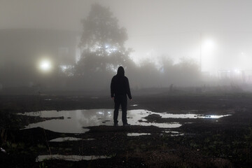 A man on a foggy night