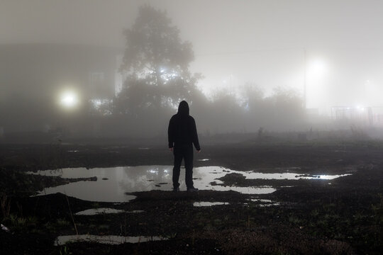 A man on a foggy night