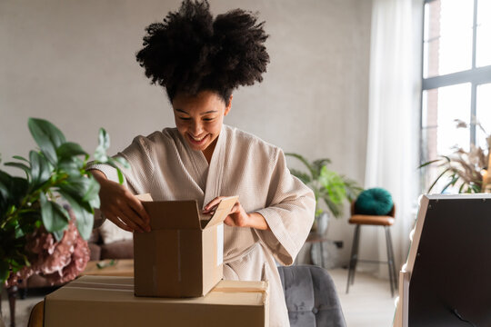 Happy Woman Unboxing Parcel