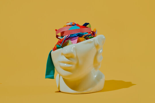 streamers and confetti in a porcelain head