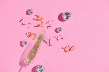 Wineglass of champagne with colored glitter and confetti