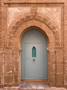 Arched entrance of old stone Islamic styled house