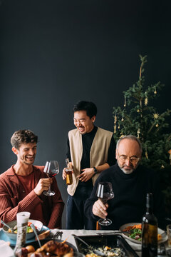 Men Toasting at Christmas Gathering 