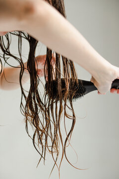 Combing wet and tangled long hair 