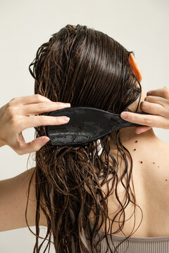 Combing wet long tangled hair 