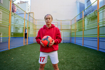 Portrait of a female soccer player on a sports field