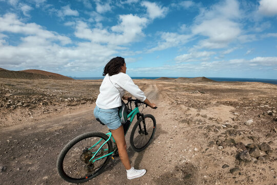 Woman riding a bike on the ground