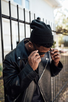 Man dressed in all black for the fall weather