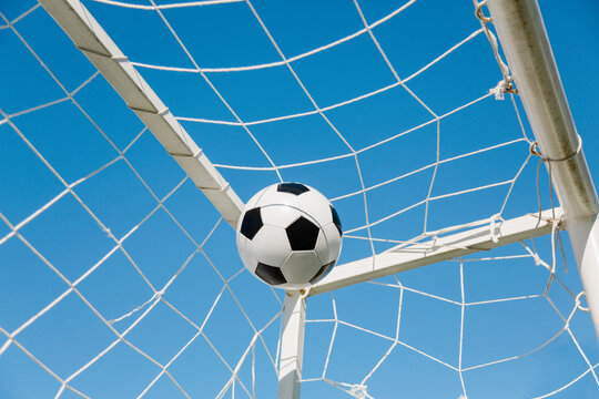 soccer ball in the net , selective focus
