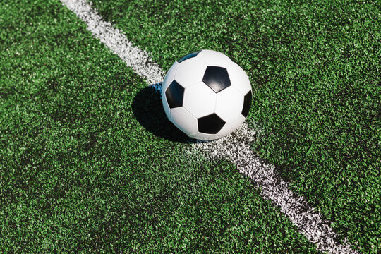 Fototapeta soccer ball on the field