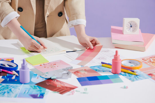  Young woman making sketch on paper