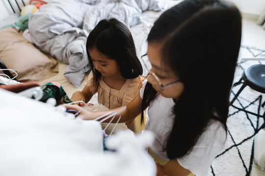 Two girl choosing what to wear.