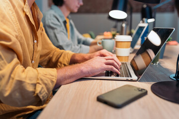 Businessmen working by computer laptop.