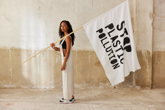 Female environmental activist with flag
