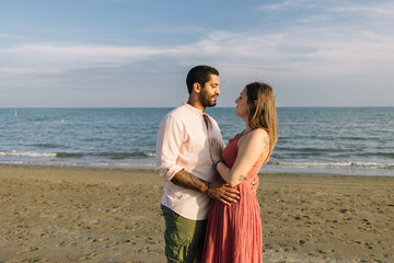 Couple Hugging At The Beach