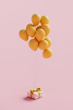 Gift box surrounded by yellow balloon. 