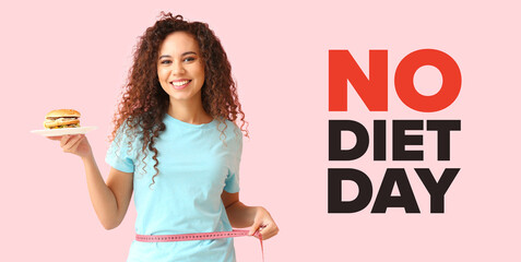 Young African-American woman with burger and measuring tape on pink background. International No Diet Day