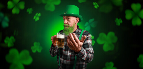 Bearded man with beer on dark background. Banner for St. Patrick's Day