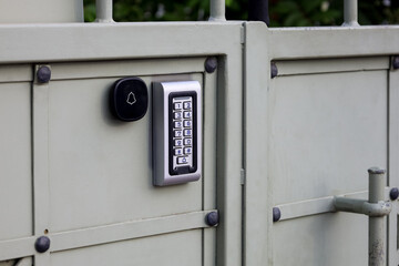 Modern intercom on metal fence
